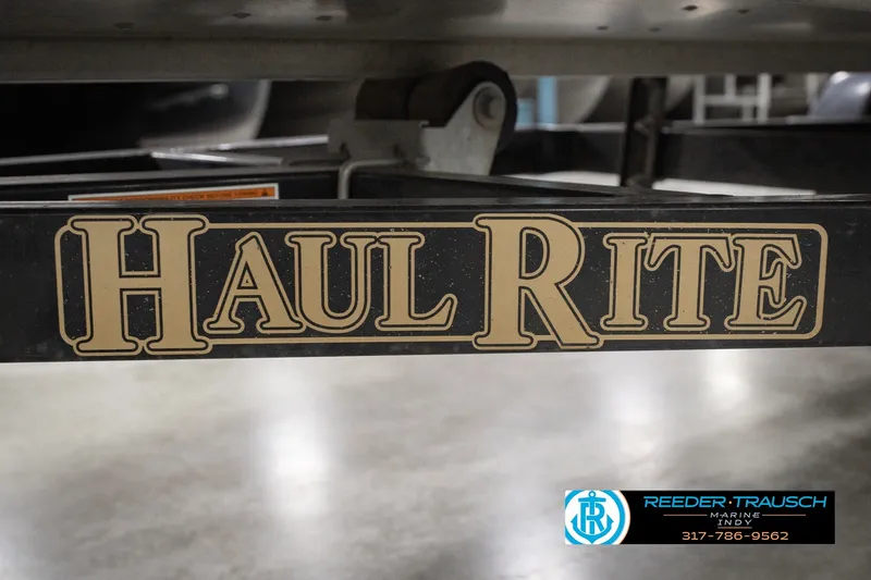 Slide: The Image of Trailer with "Haul Rite" branding, associated with a 2004 Smoker Craft Voyager boat. - 44