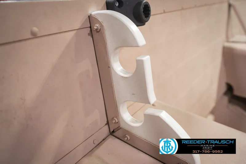Slide: The Image of 2004 Smoker Craft Voyager boat interior with rod holder detail. - 32