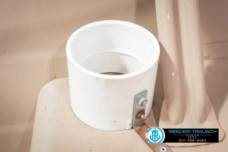 Slide: The Image of White cup holder on 2004 Smoker Craft Voyager boat interior. - 30