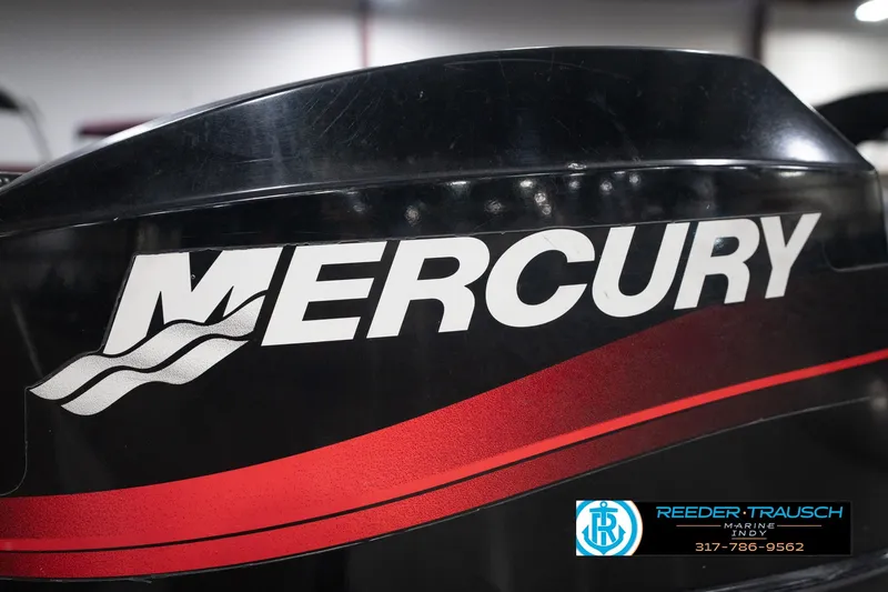 Slide: The Image of Close-up of Mercury engine on 2004 Smoker Craft Voyager boat. - 38