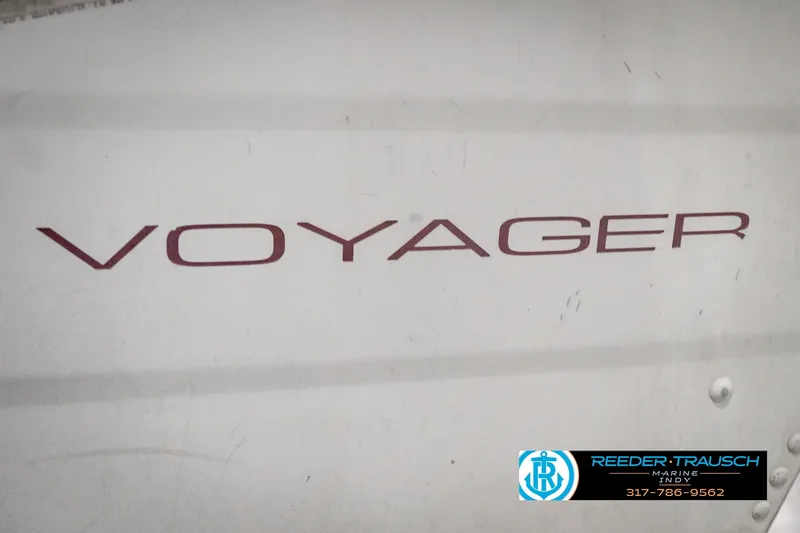 Slide: The Image of 2004 Smoker Craft Voyager boat with visible branding and dealership contact information. - 42