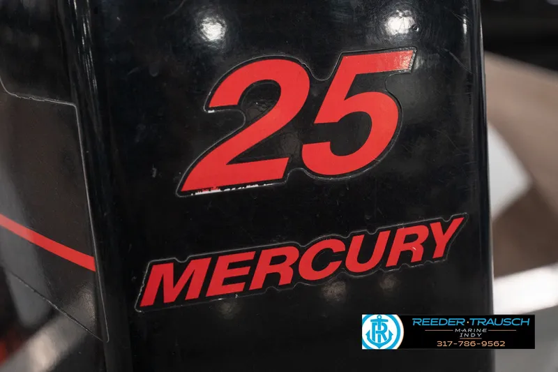 Slide: The Image of Mercury 25 horsepower engine on 2004 Smoker Craft Voyager boat. - 39