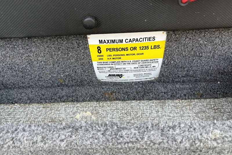 Slide: The Image of 2019 Lund 2025 Impact XS capacity label, 8 persons or 1235 lbs maximum. - 9