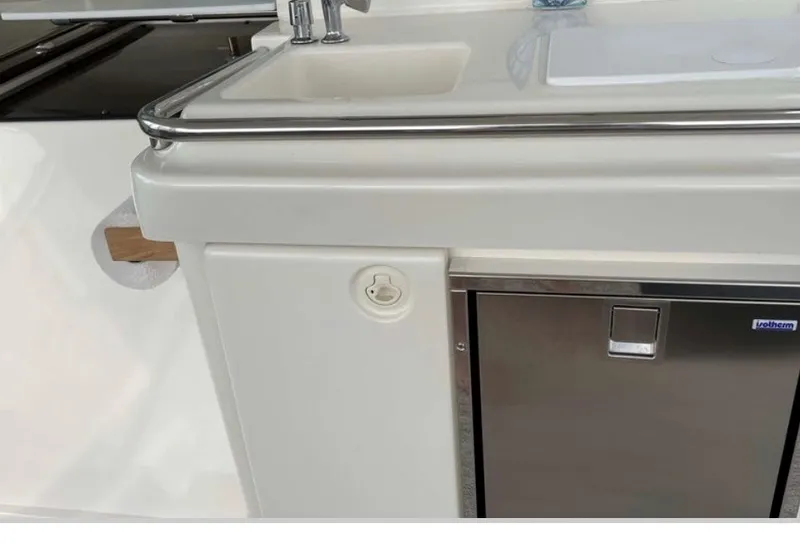 Slide: The Image of Galley area with sink and stainless steel surface on a 1997 Silverton 372 Motor Yacht. - 20