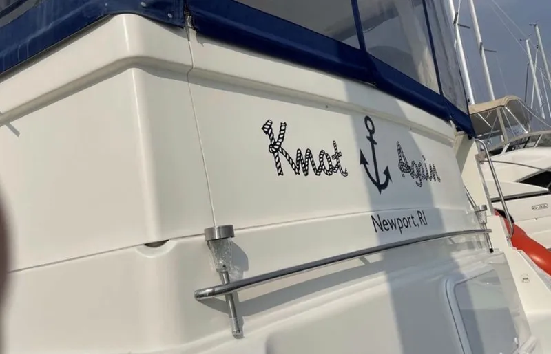 Slide: The Image of Rear view of a 1997 Silverton 372 Motor Yacht named "Knot Again." - 23