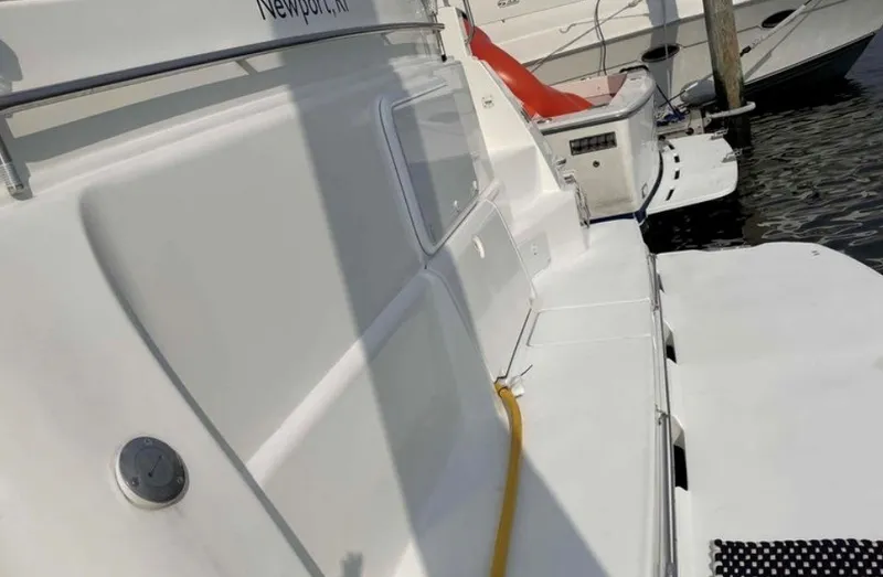 Slide: The Image of The image shows the deck of a 1997 Silverton 372 Motor Yacht docked at a pier. - 24