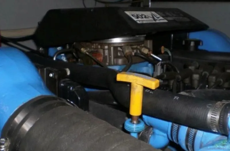 Slide: The Image of Close-up of an engine compartment with blue hoses and a yellow handle. - 29