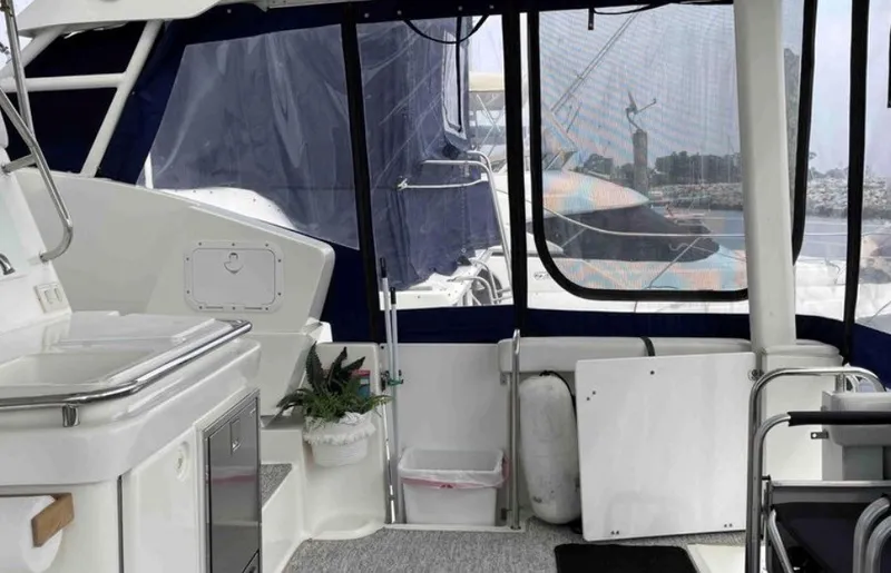 Slide: The Image of Interior of a 1997 Silverton 372 Motor Yacht with a view of the harbor. - 19