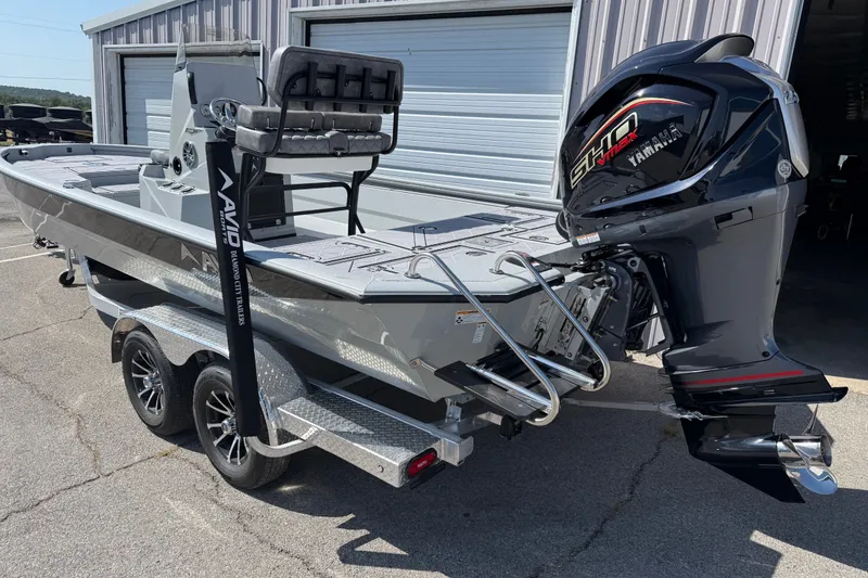 Slide: The Image of 2027 Avid 23 Mag boat with Yamaha outboard motor on a trailer. - 2