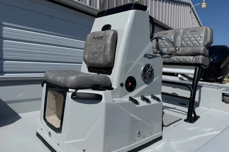 Slide: The Image of Avid 23 Mag 2027 boat interior with gray seating and modern console design. - 5