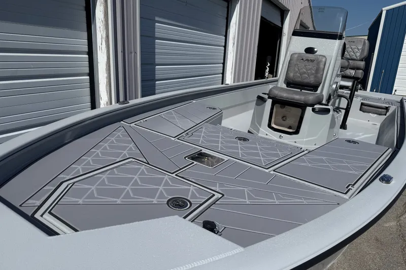 Slide: The Image of Avid 23 Mag 2027 boat with sleek gray deck design and comfortable seating. - 7