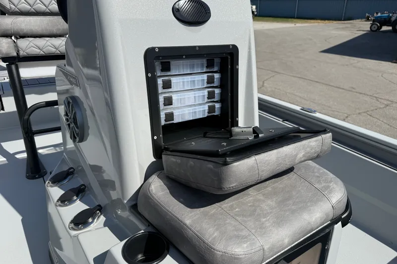 Slide: The Image of Avid 23 Mag 2027 boat interior with storage compartments and seating. - 13