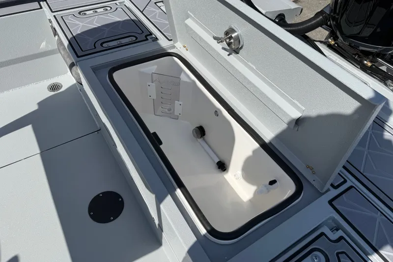 Slide: The Image of Open storage compartment on 2027 Avid 23 Mag boat deck. - 25