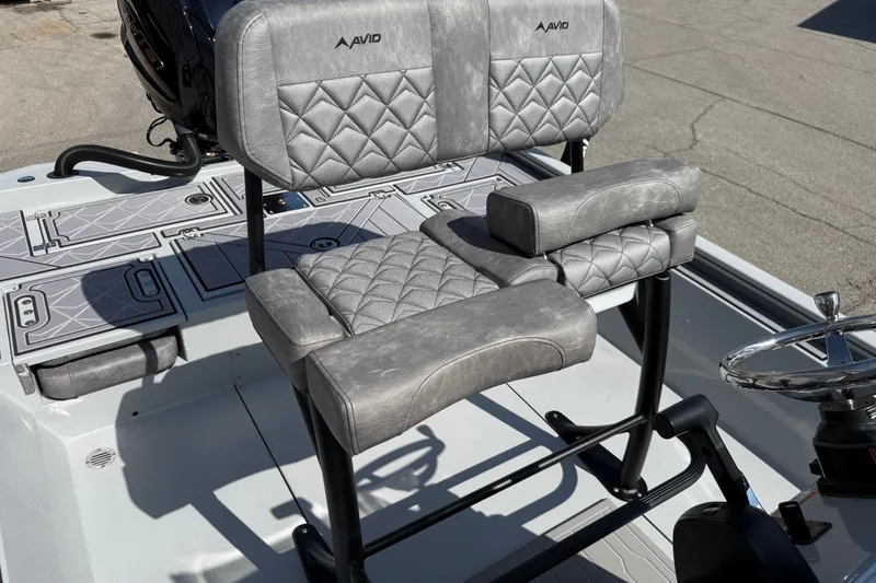 Slide: The Image of Avid 23 Mag 2027 boat seat with quilted gray upholstery and armrests. - 16