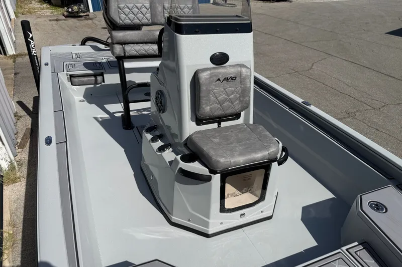 Slide: The Image of Avid 23 Mag 2027 boat interior with gray seating and console. - 11