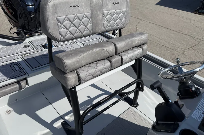 Slide: The Image of Avid 23 Mag 2027 boat seat with quilted design and steering wheel. - 15