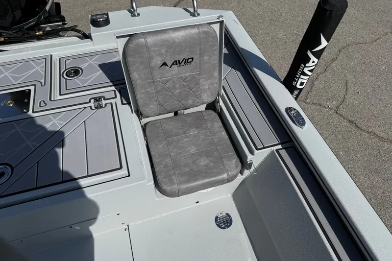 Slide: The Image of Avid 23 Mag 2027 boat seat with gray upholstery and sleek design. - 23