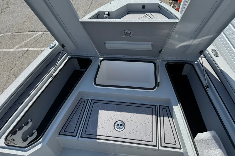 Slide: The Image of Open storage compartments on a 2027 Avid 23 Mag boat, showcasing spacious interior design. - 9