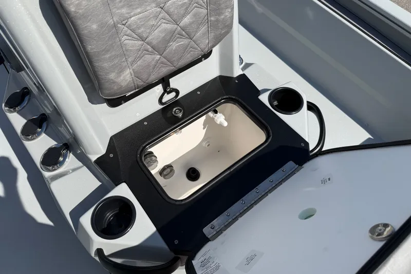 Slide: The Image of Avid 23 Mag 2027 boat interior with storage compartment and seating. - 14