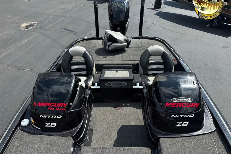 Slide: The Image of 2012 Nitro Z-8 boat with dual Mercury engines, featuring spacious seating and storage. - 6