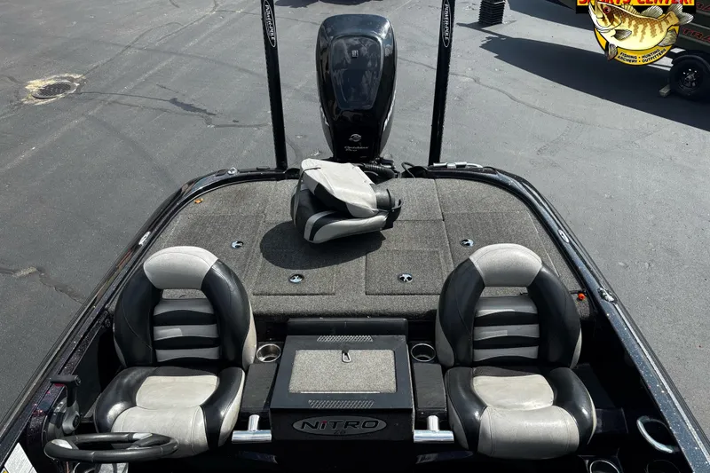 Slide: The Image of 2012 Nitro Z-8 boat interior with dual seats and steering wheel on a sunny day. - 5
