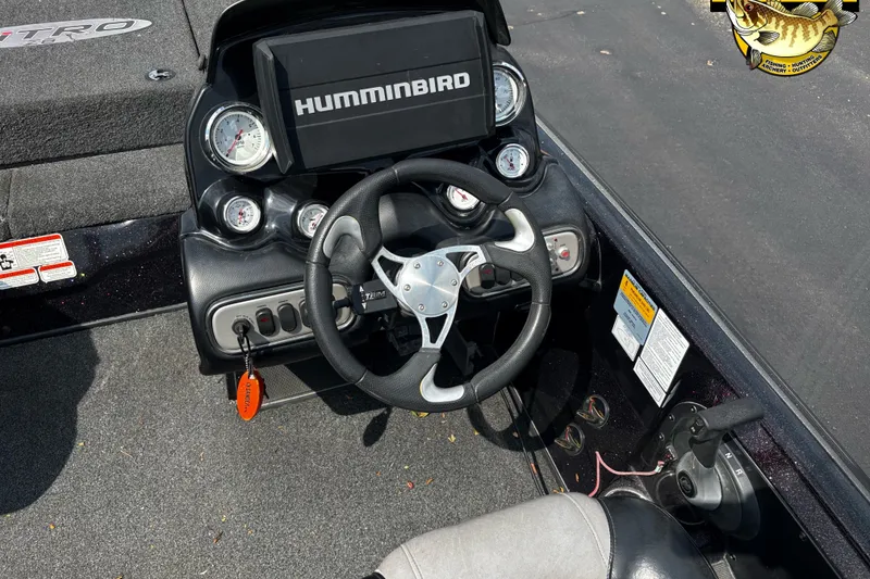 Slide: The Image of Steering console of 2012 Nitro Z-8 boat with Humminbird display and gauges. - 11