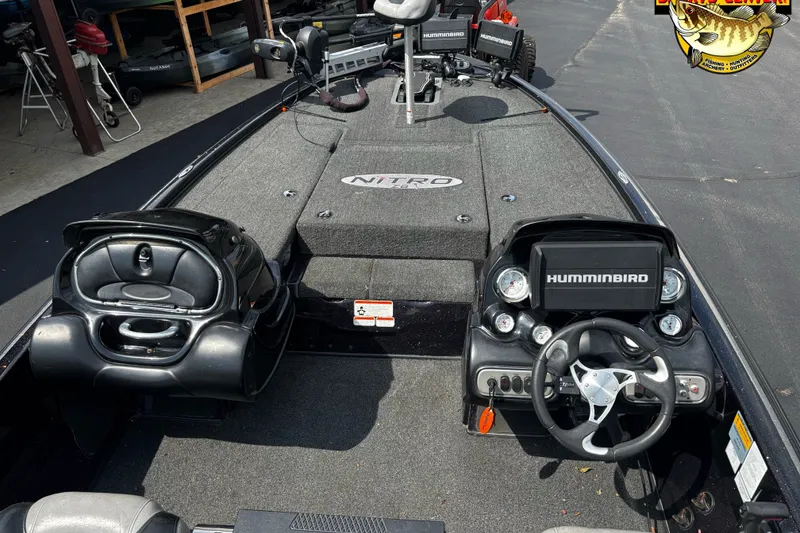 Slide: The Image of 2012 Nitro Z-8 boat interior with Humminbird electronics and steering wheel. - 12