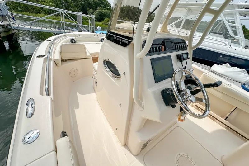 Slide: The Image of 2022 Grady-White Fisherman 216 boat interior with steering console and navigation equipment. - 17