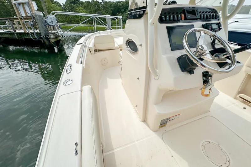 Slide: The Image of 2022 Grady-White Fisherman 216 boat interior with steering console and seating. - 12