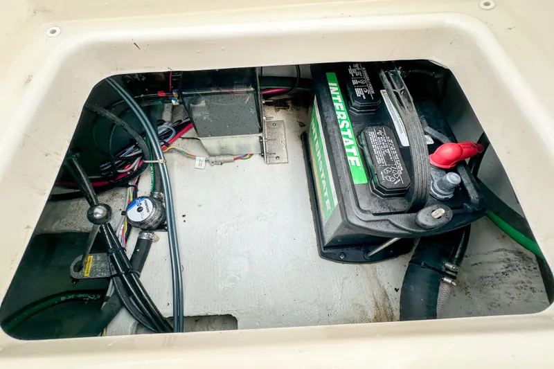 Slide: The Image of Battery compartment of 2022 Grady-White Fisherman 216 boat with wiring and components. - 35