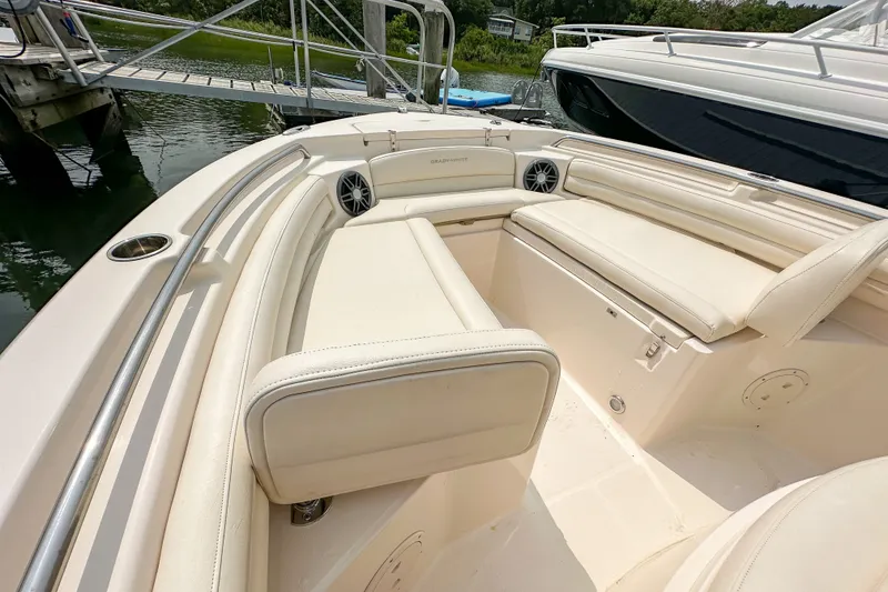 Slide: The Image of 2022 Grady-White Fisherman 216 boat interior with cushioned seating and stainless steel railings. - 29