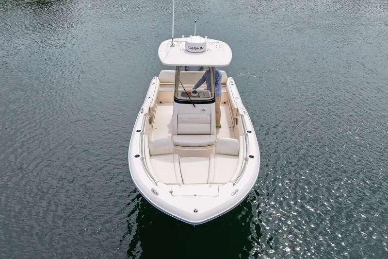 Slide: The Image of 2022 Grady-White Fisherman 216 boat on calm water, aerial view. - 9