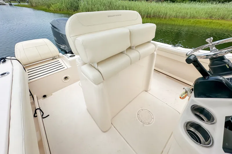 Slide: The Image of 2022 Grady-White Fisherman 216 boat interior with helm and seating. - 18