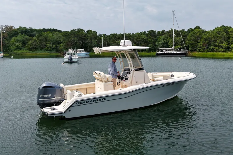 Slide: The Image of 2022 Grady-White Fisherman 216 boat on calm water with Yamaha engine. - 39