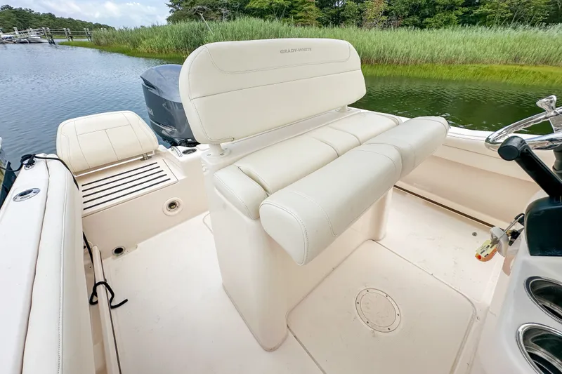 Slide: The Image of 2022 Grady-White Fisherman 216 boat interior with seating and steering wheel. - 19