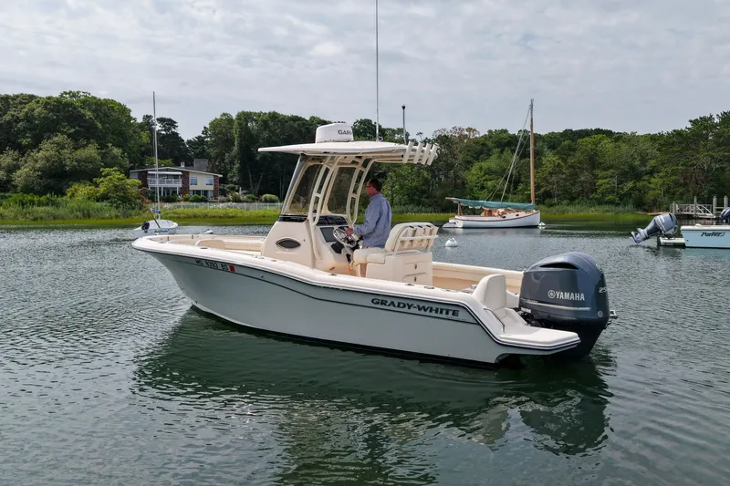 Slide: The Image of 2022 Grady-White Fisherman 216 boat on calm water with Yamaha engine. - 5