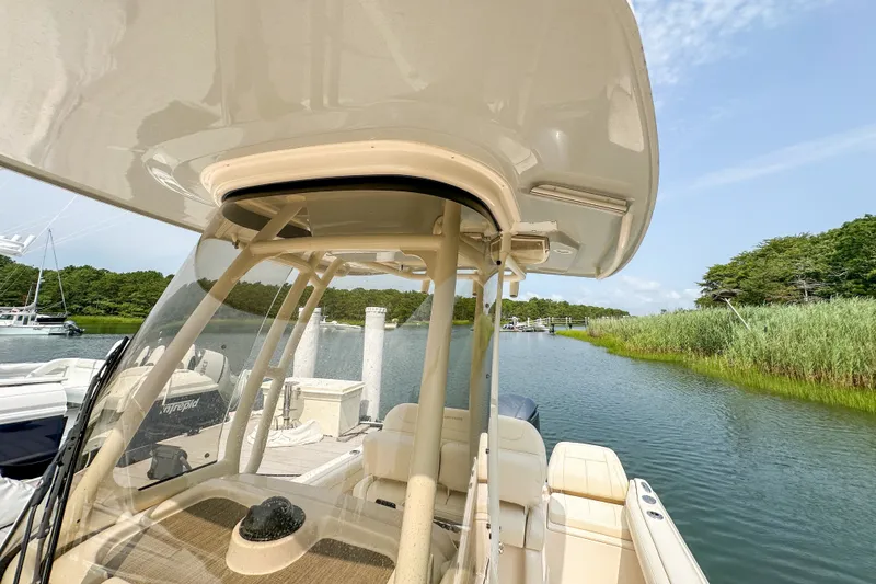 Slide: The Image of 2022 Grady-White Fisherman 216 boat docked by a serene, lush riverside. - 32