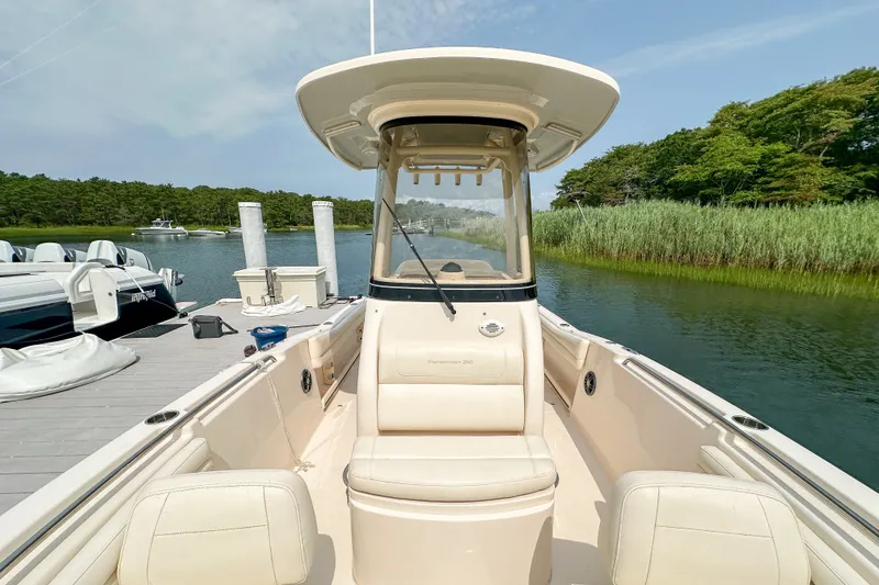 Slide: The Image of 2022 Grady-White Fisherman 216 boat docked by lush greenery and calm waters. - 30