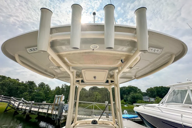 Slide: The Image of 2022 Grady-White Fisherman 216 boat with T-top and rod holders at dock. - 16