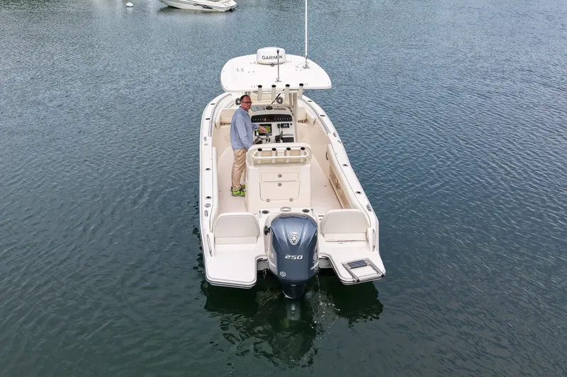 Slide: The Image of 2022 Grady-White Fisherman 216 boat on water, featuring a powerful 250 engine. - 46
