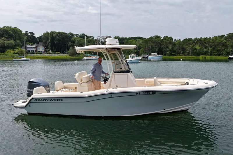 Slide: The Image of 2022 Grady-White Fisherman 216 boat on calm water with scenic background. - 1