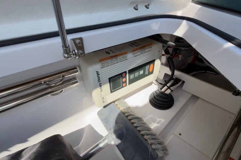 Slide: The Image of Battery charger setup in 2023 Axopar 28 Cabin boat interior. - 39