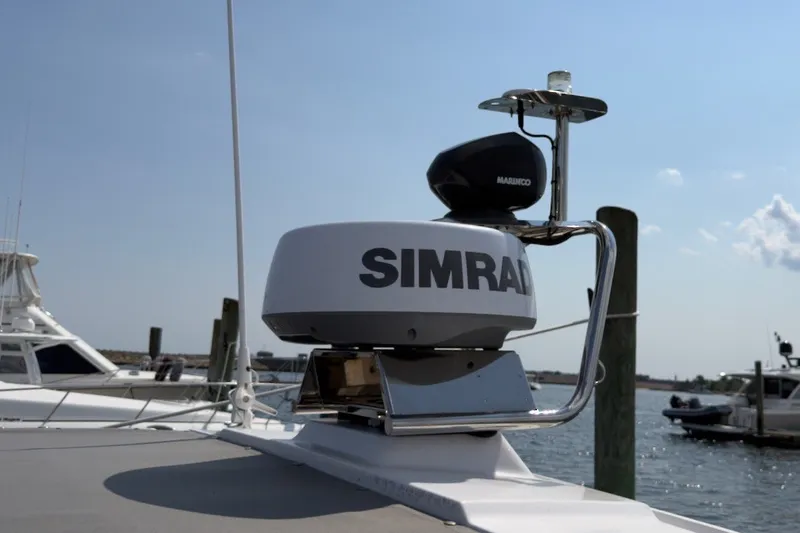 Slide: The Image of Simrad radar on 2023 Axopar 28 Cabin boat, docked in a marina. - 44