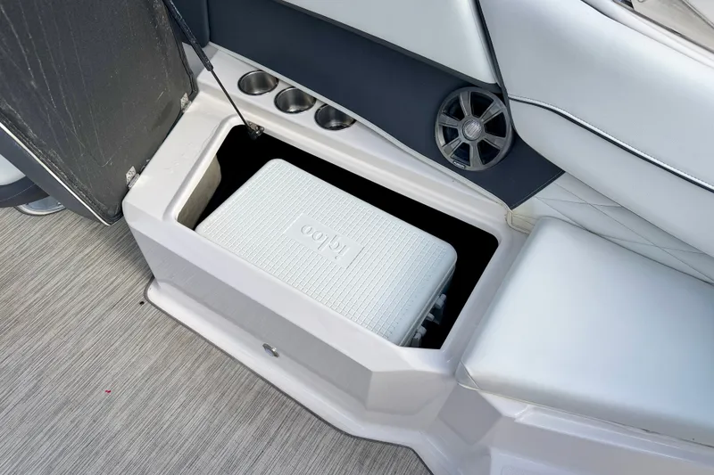 Slide: The Image of Storage compartment with Igloo cooler in 2019 Regal 23 OBX boat interior. - 24