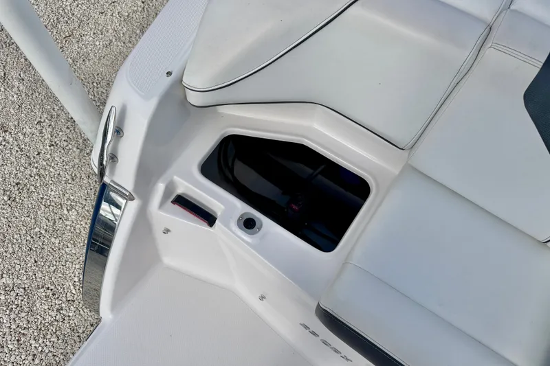 Slide: The Image of 2019 Regal 23 OBX boat interior detail with storage compartment and seating. - 38