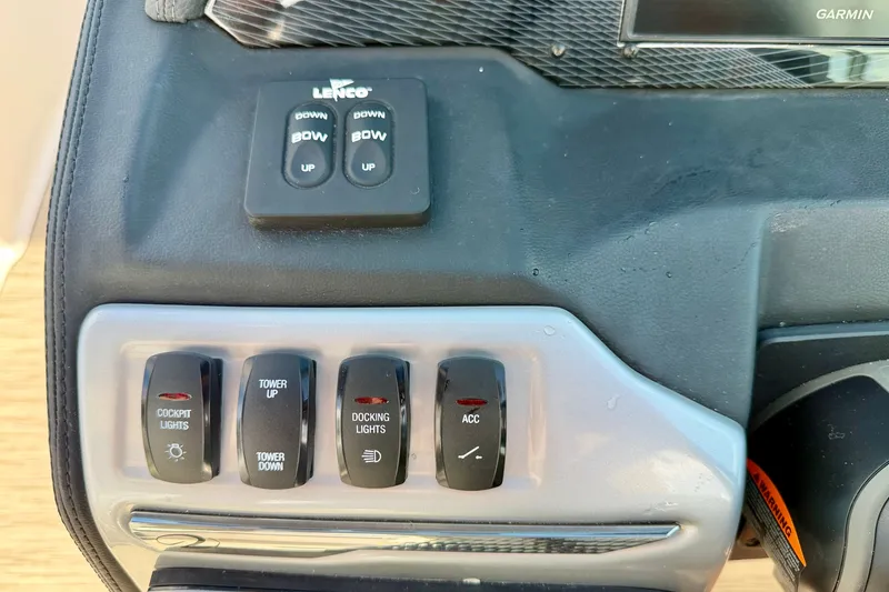 Slide: The Image of Control panel of a 2019 Regal 23 OBX boat with switches for lights and accessories. - 17