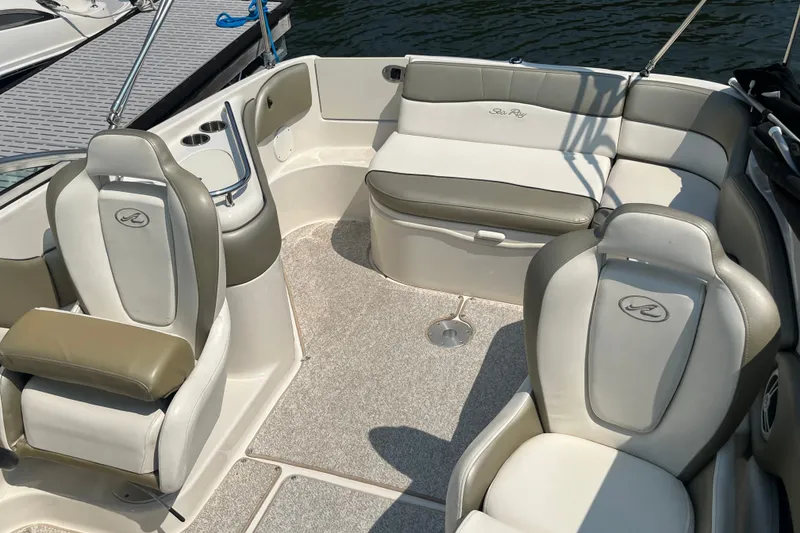 Slide: The Image of Interior of a 2007 Sea Ray 240 Sundeck boat with comfortable seating. - 22