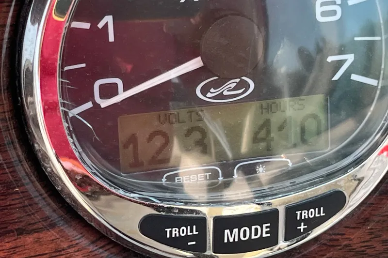 Slide: The Image of Close-up of 2007 Sea Ray 240 Sundeck gauge showing 12.3 volts and 410 hours. - 17