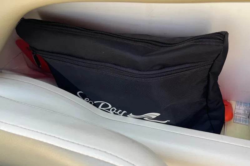 Slide: The Image of Black Sea Ray bag in a 2007 Sea Ray 240 Sundeck storage compartment. - 23