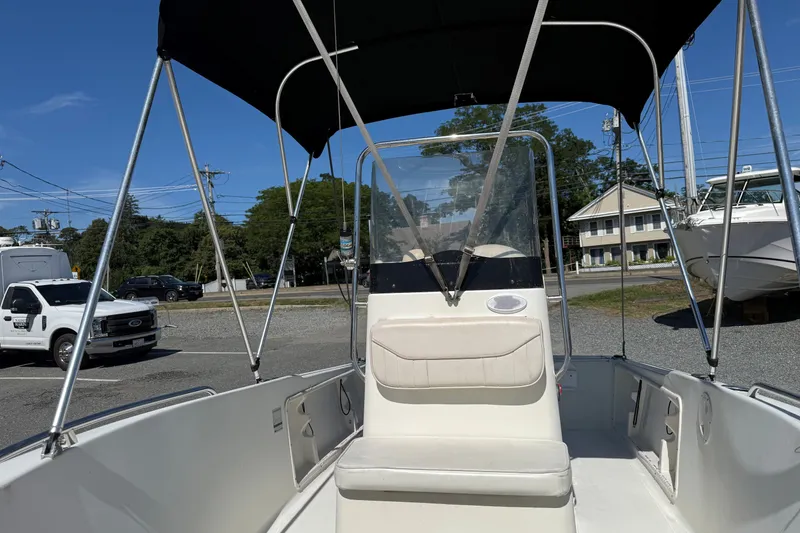 Slide: The Image of 2004 Hydra-Sports Lightning 170 CC boat with canopy, parked outdoors. - 4